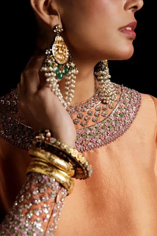 Vaskas - HR pakistani fashion outfit in peach, blue, teal tones.